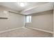 Bright and airy basement bedroom with neutral carpeting at 2664 S Cherokee St, Denver, CO 80223