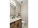 Modern bathroom with a vanity, toilet and black fixtures at 2664 S Cherokee St, Denver, CO 80223