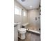 Bathroom with a walk-in shower, toilet and modern vanity at 2664 S Cherokee St, Denver, CO 80223