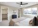 Comfortable bedroom with large window and ceiling fan at 2664 S Cherokee St, Denver, CO 80223