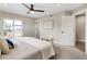 Bright and spacious bedroom with large windows and a ceiling fan at 2664 S Cherokee St, Denver, CO 80223