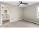 Bright bedroom with neutral walls, carpet, and ceiling fan at 2664 S Cherokee St, Denver, CO 80223