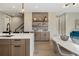 Kitchen features a built-in bar and dining area with a white table at 2664 S Cherokee St, Denver, CO 80223