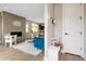 Bright entryway with built-in bench, coat rack and view of living room at 2664 S Cherokee St, Denver, CO 80223