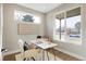 Bright home office with large windows and built-in shelving at 2664 S Cherokee St, Denver, CO 80223