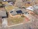 An overhead view of a single-Gathering home with solar panels on the roof, showing the yard and surrounding neighborhood at 8235 Auburn Ln, Westminster, CO 80031