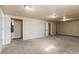 Expansive basement area with carpeted floors and recessed lighting at 8235 Auburn Ln, Westminster, CO 80031