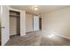 Carpeted basement bedroom with a closet and interior door at 8235 Auburn Ln, Westminster, CO 80031