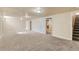 Spacious basement featuring neutral carpeting and walls, offering a versatile living space at 8235 Auburn Ln, Westminster, CO 80031