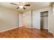 Cozy bedroom with hardwood floors, a ceiling fan, and a closet at 8235 Auburn Ln, Westminster, CO 80031
