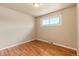 Cozy bedroom featuring gleaming hardwood floors and natural light at 8235 Auburn Ln, Westminster, CO 80031