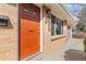 Close-up of the front door with brick facade and visible house number at 8235 Auburn Ln, Westminster, CO 80031