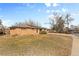 Charming brick ranch home with a well-maintained front yard under a sunny blue sky at 8235 Auburn Ln, Westminster, CO 80031