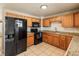 Well-equipped kitchen with tile floors, modern appliances, and ample cabinet space at 8235 Auburn Ln, Westminster, CO 80031