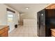 Spacious kitchen with tile floors and appliances, offering functionality at 8235 Auburn Ln, Westminster, CO 80031