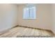 Bright basement room with wood-look floors and large window at 9719 Canyon Wind Pt, Parker, CO 80138