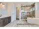 Luxurious bathroom with a soaking tub and walk-in shower at 9719 Canyon Wind Pt, Parker, CO 80138