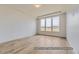 Bright and airy bedroom with hardwood floors and large windows at 9719 Canyon Wind Pt, Parker, CO 80138