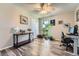 Versatile room features wood-look floors, lots of natural light, and a home office setup at 15531 E Jewell Pl, Aurora, CO 80013