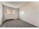 Minimalist bedroom with neutral walls and carpet, perfect for creating a serene and relaxing retreat at 15531 E Jewell Pl, Aurora, CO 80013