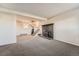 Spacious living room with a brick fireplace and plenty of room for seating at 15531 E Jewell Pl, Aurora, CO 80013
