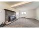 Cozy living room features a brick fireplace and ample space for relaxation at 15531 E Jewell Pl, Aurora, CO 80013