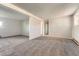 Spacious living room with neutral walls and plush carpet, providing a comfortable and versatile living area at 15531 E Jewell Pl, Aurora, CO 80013