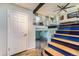 Modern staircase with glass railings, hardwood floors, and open design at 15531 E Jewell Pl, Aurora, CO 80013