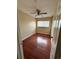 Bedroom featuring hardwood floors, a ceiling fan, and a window at 8047 Wolff St # H, Westminster, CO 80031