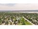 Aerial view of residential area near the city featuring a neighborhood pond at 8977 W Toller Ave, Littleton, CO 80128