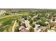 Aerial view of a neighborhood with tree-lined streets and well-maintained homes at 8977 W Toller Ave, Littleton, CO 80128
