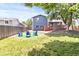 Home exterior showcasing a wooden deck and fenced backyard with an outdoor seating area at 8977 W Toller Ave, Littleton, CO 80128