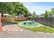 Cozy backyard with an inviting fire pit area, perfect for entertaining and relaxation in outdoor space at 8977 W Toller Ave, Littleton, CO 80128