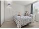 Cozy bedroom features a white metal bed frame and a built-in desk at 8977 W Toller Ave, Littleton, CO 80128