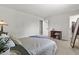 Spacious bedroom with neutral carpet, soft lighting, and a walk-in closet at 8977 W Toller Ave, Littleton, CO 80128