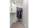 Walk-in closet with upper and lower racks and neutral colored carpet at 8977 W Toller Ave, Littleton, CO 80128