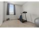 Exercise room with neutral colored carpet and lots of natural light at 8977 W Toller Ave, Littleton, CO 80128