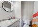 Well-lit bathroom featuring modern fixtures, a sleek vanity, and neutral décor at 12063 Monaco Ct, Brighton, CO 80602