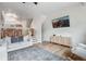 Spacious living room with a TV, stylish console, and stairs leading to the next level at 12063 Monaco Ct, Brighton, CO 80602