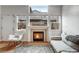 Comfortable living room with a fireplace, natural light, and stylish decor at 12063 Monaco Ct, Brighton, CO 80602