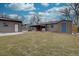 A large backyard with a firepit provides an expansive outdoor area for relaxation and entertainment at 3290 S Holly St, Denver, CO 80222