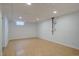 Unfinished basement space with hardwood floors and recessed lighting at 3290 S Holly St, Denver, CO 80222