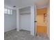 A basement bedroom showcases a closet and gray carpet, offering a simple and functional living space at 3290 S Holly St, Denver, CO 80222