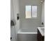 Clean bathroom with a shower-tub combination and stylish modern vanity at 3290 S Holly St, Denver, CO 80222