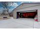 Spacious garage with ample room for parking and storage, featuring a wide entrance and durable concrete flooring at 3290 S Holly St, Denver, CO 80222