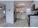 Modern kitchen with stainless steel appliances, white cabinetry and contemporary tile flooring at 3290 S Holly St, Denver, CO 80222