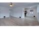 Bright living room showcasing hardwood floors flowing into the adjacent kitchen at 3290 S Holly St, Denver, CO 80222