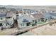 Aerial view of backyard featuring a fence, landscaping, a small patio, and solar panels on the roof at 17490 W 94Th Dr, Arvada, CO 80007