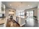 Open kitchen featuring center island, stainless steel appliances, and connection to the dining and living spaces at 17490 W 94Th Dr, Arvada, CO 80007