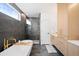 Luxurious bathroom with a soaking tub, glass-enclosed shower, and modern fixtures, designed for relaxation at 4236 Zuni St, Denver, CO 80211